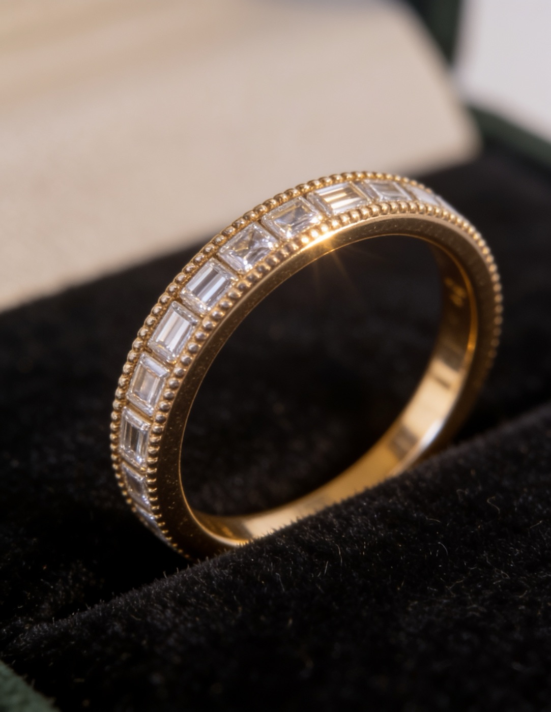 Yellow-gold baguette-diamond eternity band in the D8 London box