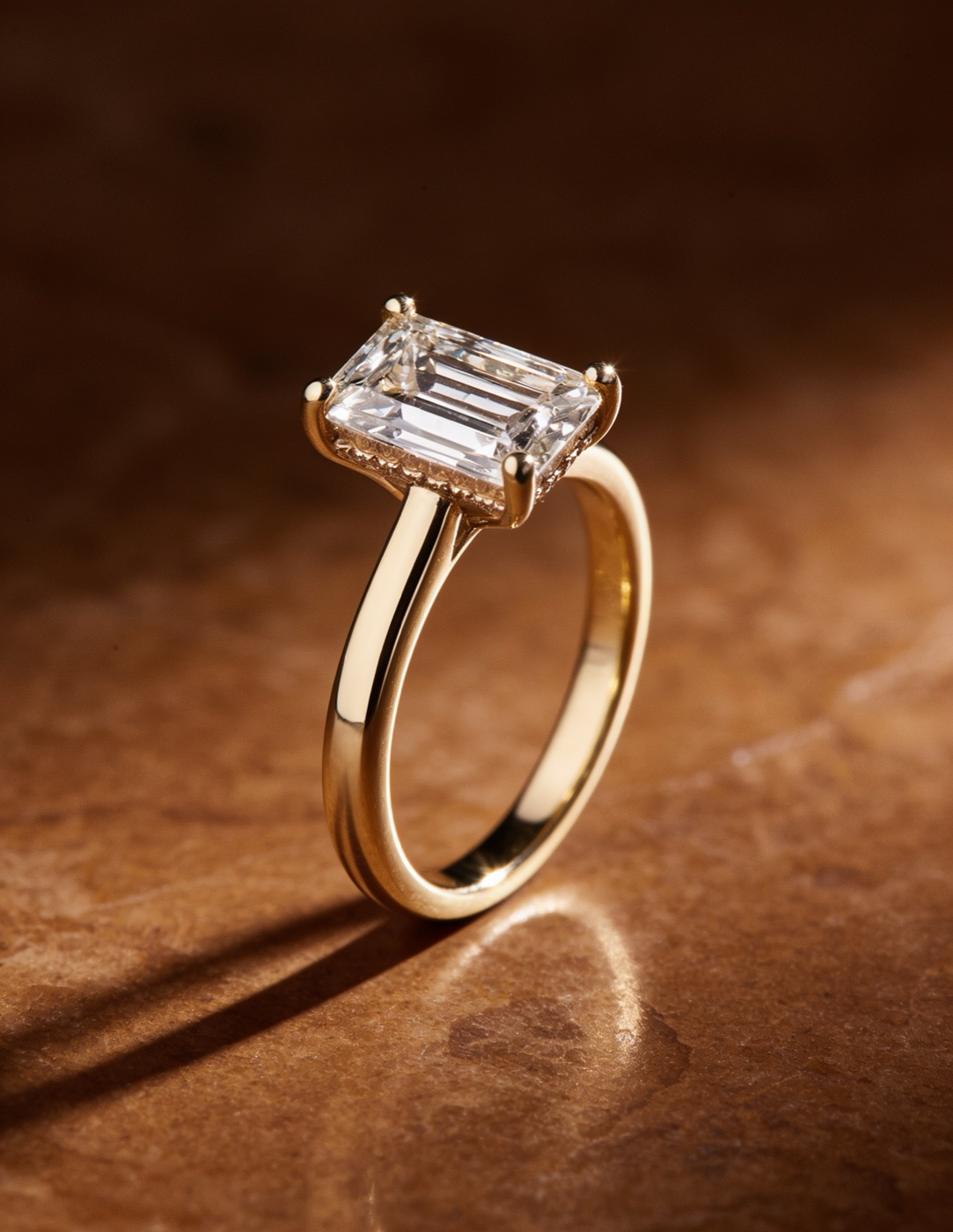 Yellow-gold emerald-cut diamond solitaire ring